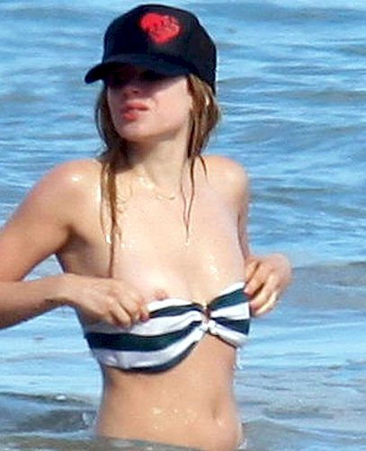 Great nip slip from rocker chick Avril Lavigne while in a bikini