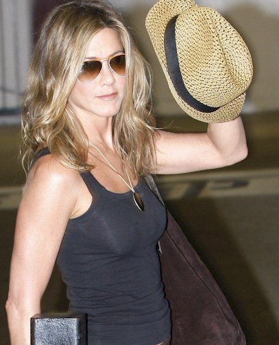 A couple of candids of Jennifer Aniston being braless in a tank top