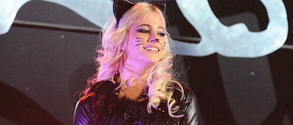 Here's Pixie Lott performing in a latex cat suit