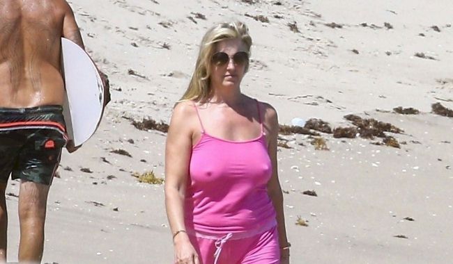 Candids of Penny Lancaster hanging out at the beach with her husband Rod St...