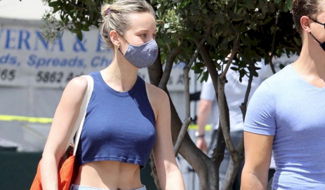 Candids of Brie Larson showing nipple pokies and midriff by wearing a tiny top...