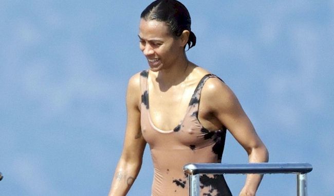 Zoe Saldana nipple pokies in a wet swimsuit