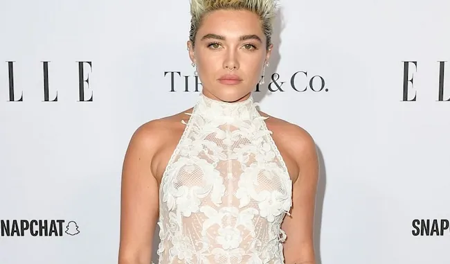 Florence Pugh braless in a see through dress