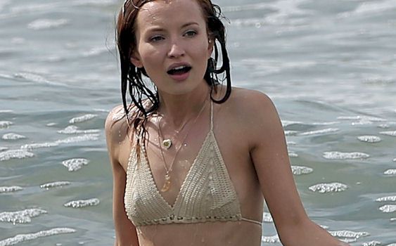 Great pics of Emily Browning wearing a wet bikini while filming a scene for...