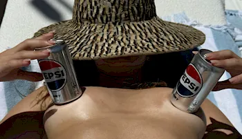 Close up of Addison Rae topless with Pepsi cans on her boobs