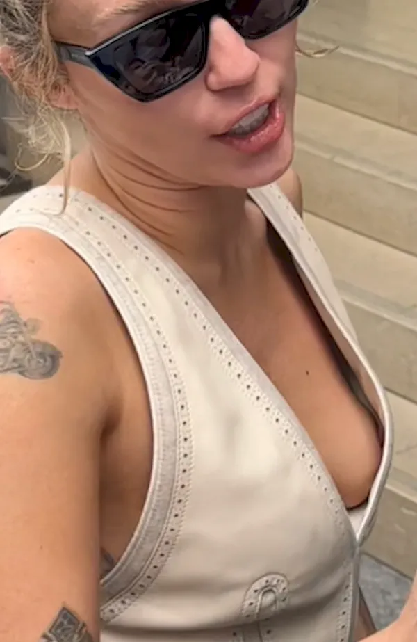 Miley Cyrus braless nip slip close up
