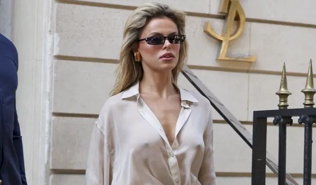 Braless blonde in a see through blouse while out in Paris