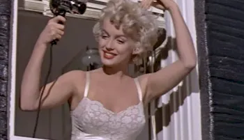 Marilyn Monroe in a bra and blow-drying her hair
