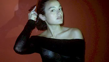 Asian actress Chase Sui Wonders posing in a sheer top