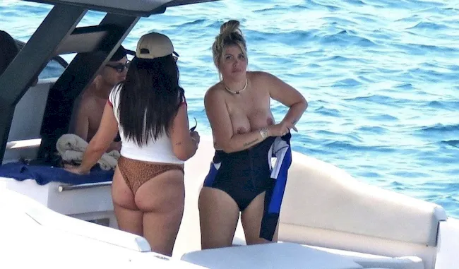 Big boob Latina caught topless putting on a wetsuit on a boat