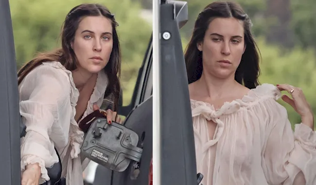 Celebrity brunette pumping gas in a sheer top