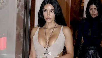 Kim Kardashian leaves a restaurant showing cleavage