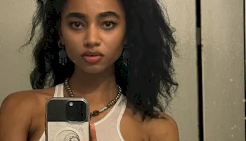 Black actress Tayler Buck snapping a selfie