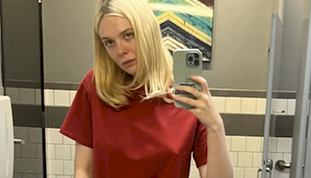 Pretty blonde braless in a red shirt