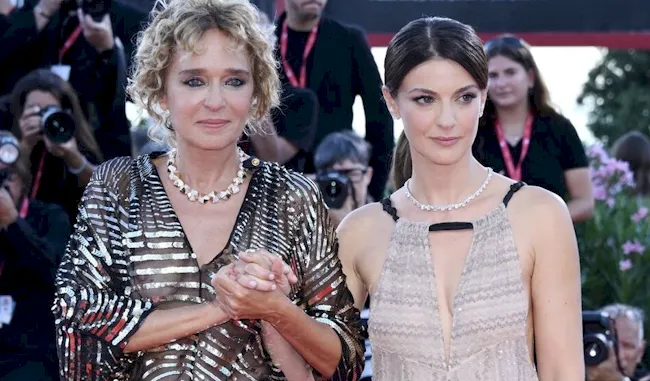 Valeria Golino and another woman walks the red carpet in Venice together