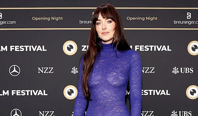 Dakota Johnson on the red carpet in a tight lace dress