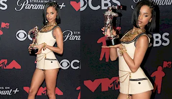 Tyla leggy while holding up her ward on the red carpet