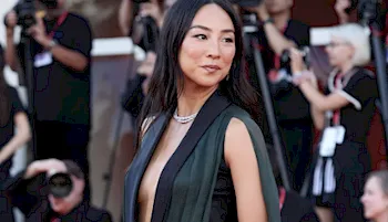 Greta Lee walks the red carpet in Venice