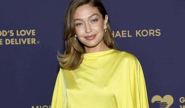 Gigi Hadid posing for the cameras in a pretty dress