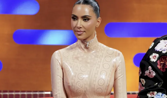 Kim Kardashian sitting down on a TV show