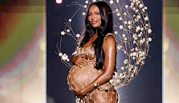 Pregnant Jasmin Tookes side view of her big belly on the runway