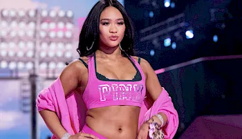 Asian gymnast Sunisa Lee showing midriff on the runway
