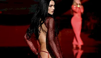 Amelia Gray Hamlin walking away and looking over her shoulder on the runway