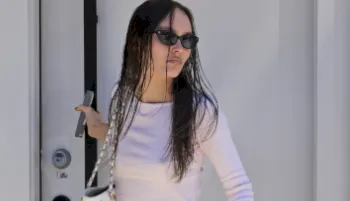 Close up Lily-Rose Depp with wet hair and wearing sunglasses