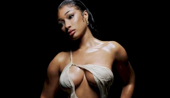 Cropped from the chest up photo of ebony girl wearing a wet and skimpy dress