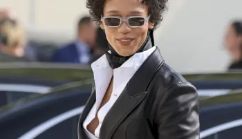 Taylor Russell in a suit and sunglasses