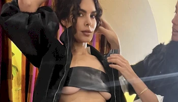 Woman getting dressed for a photo shoot