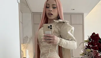 Woman snaps a selfie while looking back and sticking her tongue out