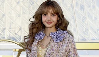 Asian popstar LISA with a  big smile on her face