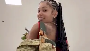 Ebony girl Coi Leray looking back over her shoulder