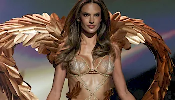 Alessandra Ambrosio in lingerie and gold angel wings on the fashion catwalk