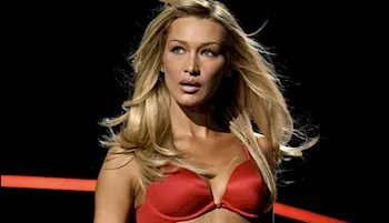 Blonde Bella Hadid on the runway in a red bra