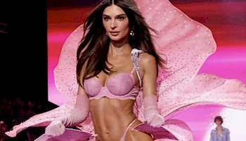Emily Ratajkowski strike a pose on the runway wearing lace underwear