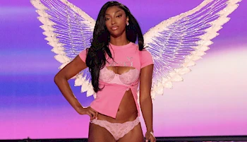 Angel Reese in pink underwear and wings on the runway
