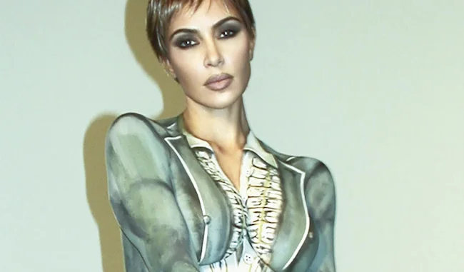 Close up of Kim Kardashian topless in body paint on the cover of a magazine