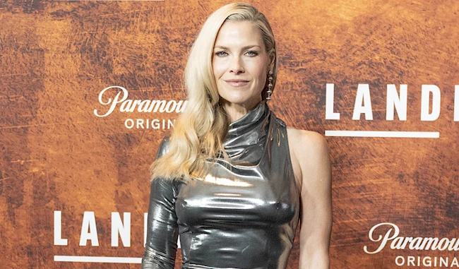 Close up of a braless Ali Larter in a silver dress