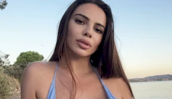 Close up of beautiful woman's face at a beach