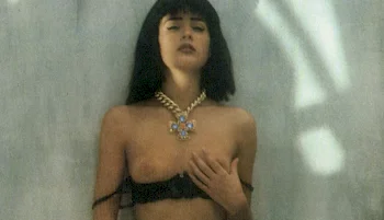 Vintage close up of a topless model touching her breast