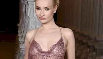 Close up of trans woman wearing a sheer dress at a glamorous event
