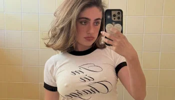 Close up of braless girl taking a selfie