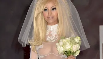 Close up of a bride wearing a semi-sheer wedding dress