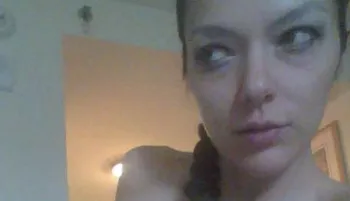 Close up of a woman's face who is looking off to the side