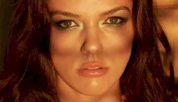 Close up of Adrienne Curry's sun lit face