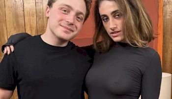 Cropped front view of woman and man posing next to each other