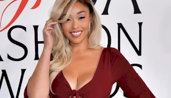 Cropped frontal view of smiling girl in a nice maroon dress