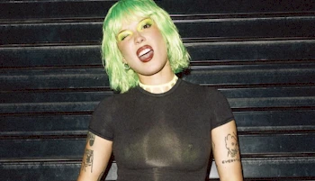 Close up of girl with green hair making a wild face